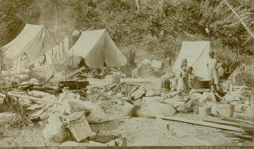 Oversized cabinet card labeled “Camp of Auk Indians, Alaska,” by Winter & Pond, 1896. Image purportedly shows an Auk’w Kwáan fishing camp with tents, gear, and Tlingit people. SHI Archive, http://goo.gl/Q30Rv9