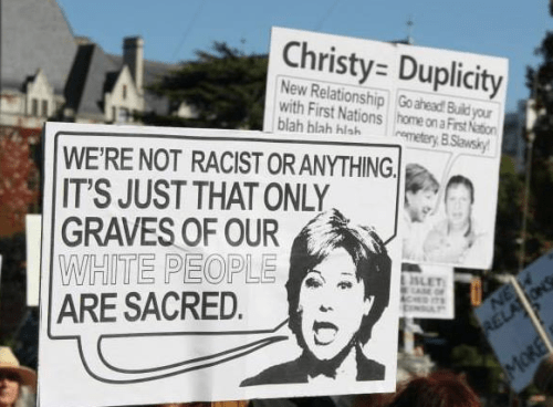 Signs condemning BC Premier Christy Clark at a rally at the BC Legislature. Source: Grace Islet facebook page.