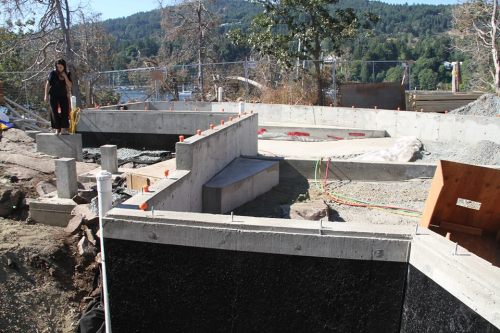 Another view showing the human burial cairn under its rectangualr box, bisected by the house foundation. Source: Grace Islet Facebook group.