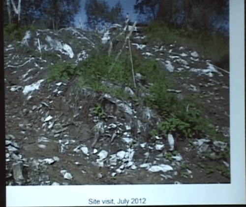 Human burial cairn with soil stripped to its perimeter as part of hoyse development site preparation. Source and description: video of lecture given by Chris Arnett.